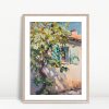 Sunlit Lemon Tree Against Cottage
