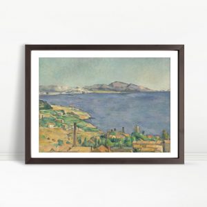 Sunlit Coastline With Distant Mountains